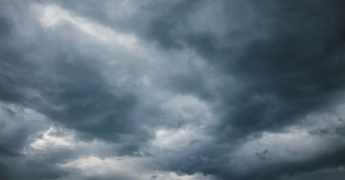 Moody sky with thick storm clouds, capturing the essence of an approaching storm.