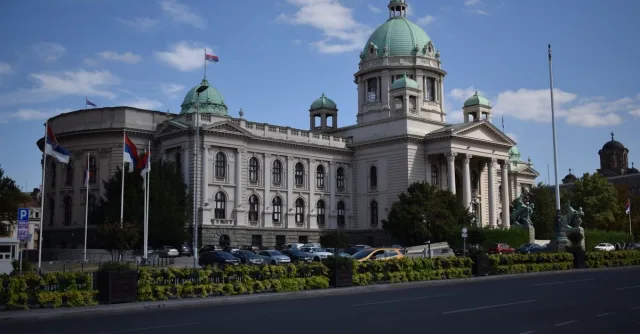 The majestic Serbian National Assembly building in Belgrade, captured on a clear day.