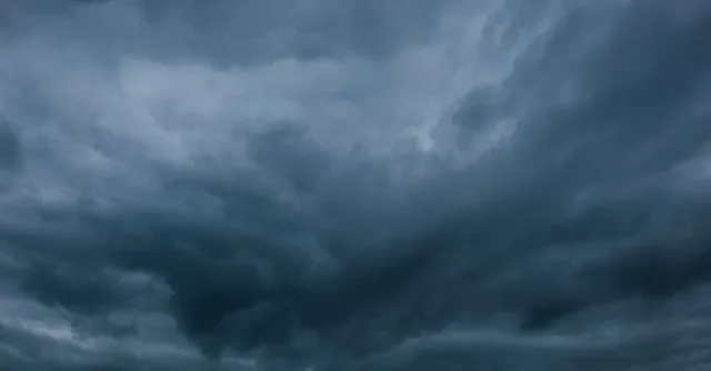 Moody and dramatic dark cloudscape capturing a stormy sky with looming clouds.