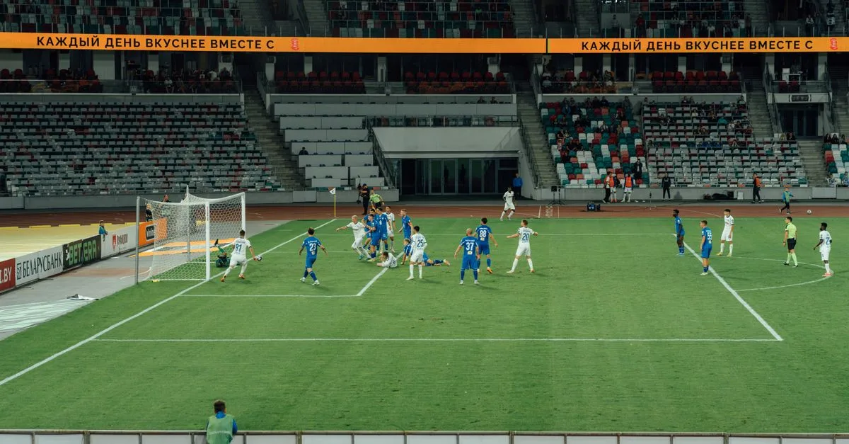 Exciting soccer match captured during day at a modern stadium.
