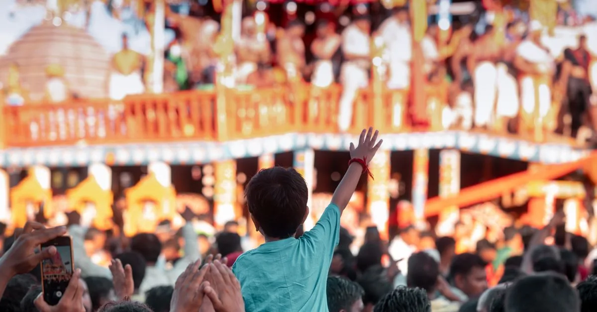 A joyful festival scene in Puri, India showing a lively gathering with colorful decorations and cultural performances.