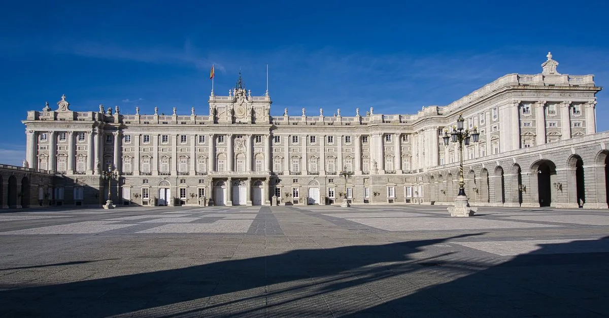 Explore the architectural beauty of the Royal Palace of Madrid on a clear day.
