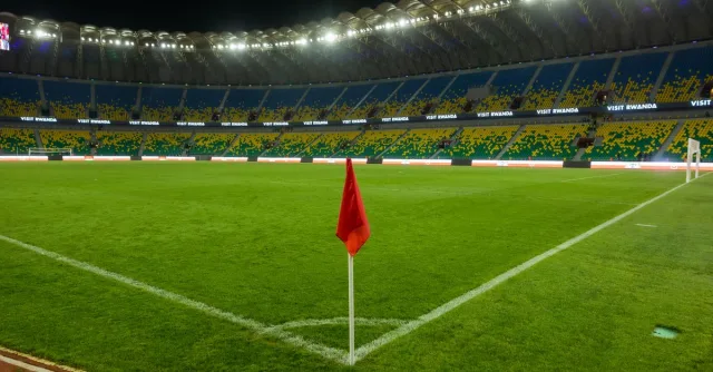 Explore Kigali's illuminated stadium, showcasing Rwanda's vibrant sports culture, captured at night.