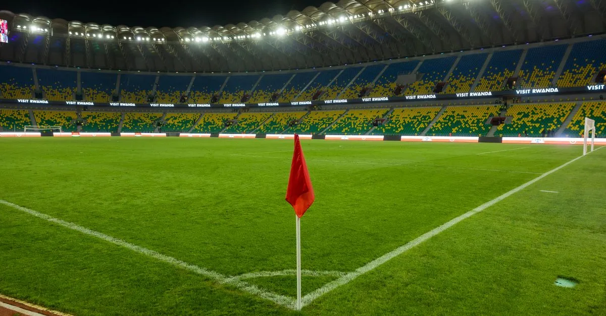 Explore Kigali's illuminated stadium, showcasing Rwanda's vibrant sports culture, captured at night.