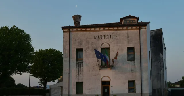 Capture of a weathered municipio building in Veneto, Italy during evening light.