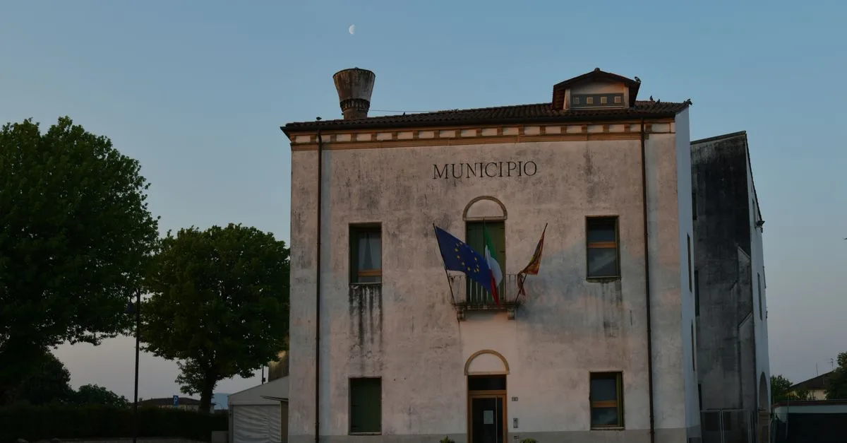 Capture of a weathered municipio building in Veneto, Italy during evening light.