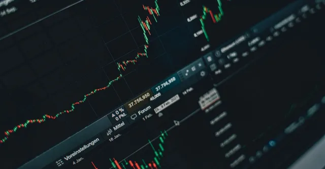 Close-up of stock market trading screen displaying financial growth and charts.