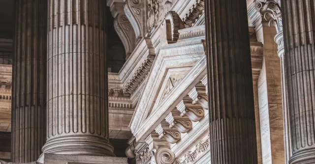 Intricate neoclassical architecture with prominent columns and ornate details.