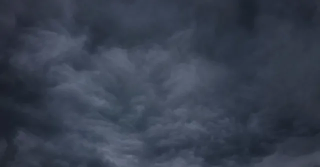 A dramatic and moody sky filled with dark storm clouds, creating a sense of impending weather change.