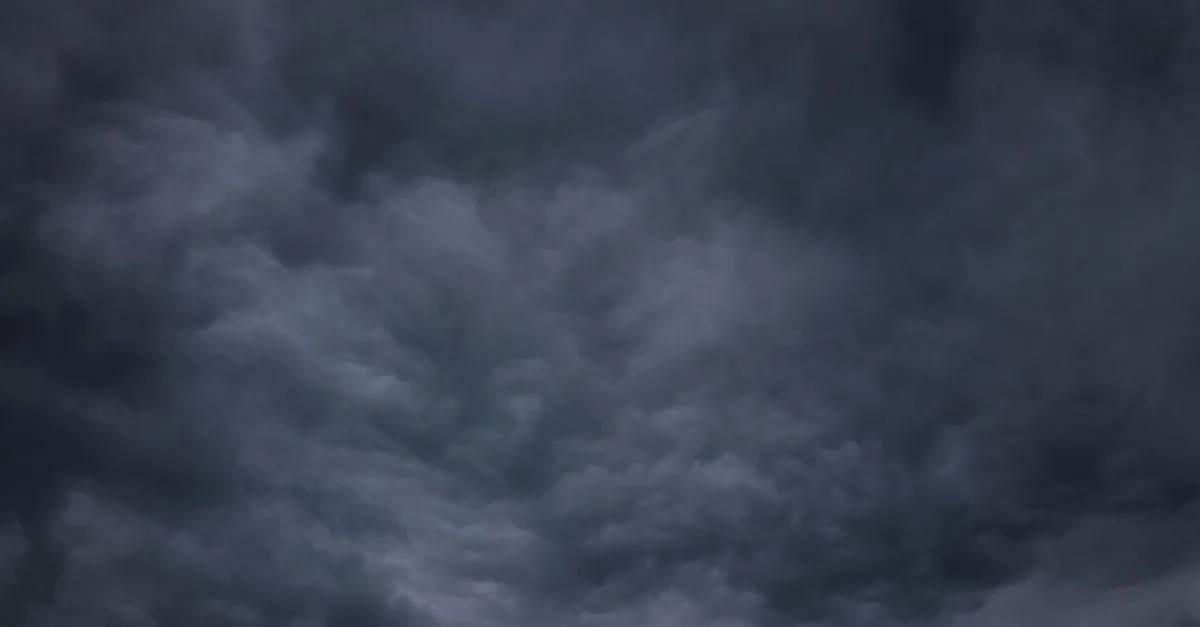 A dramatic and moody sky filled with dark storm clouds, creating a sense of impending weather change.