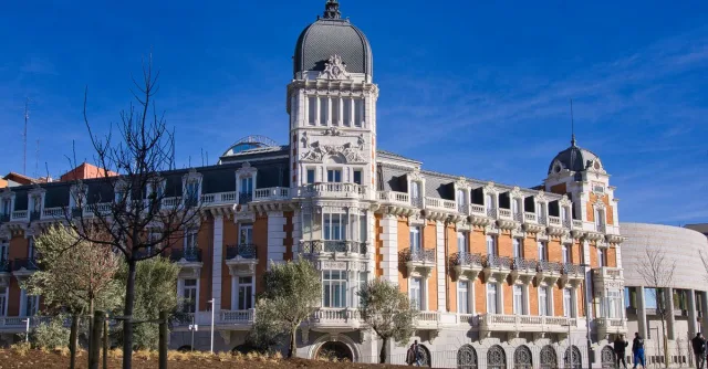 Capture of a historic building facade with a blue sky in Madrid, Spain.
