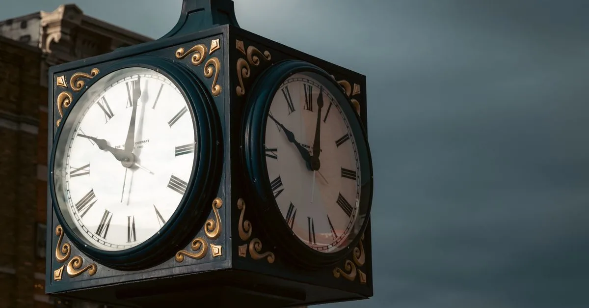 Elevate spaces with a classic outdoor clock displaying Roman numerals against a moody sky backdrop.