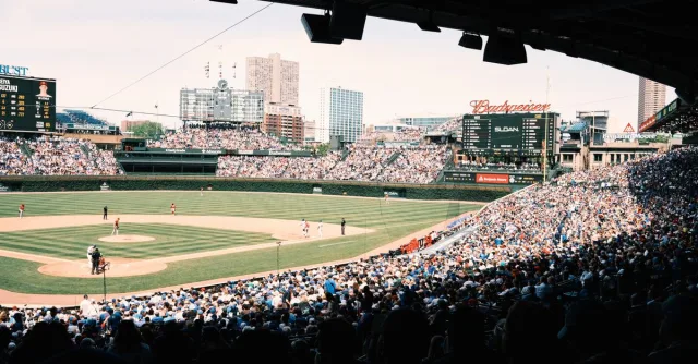 A lively baseball game at Wrigley Field with a packed crowd in Chicago, Illinois.