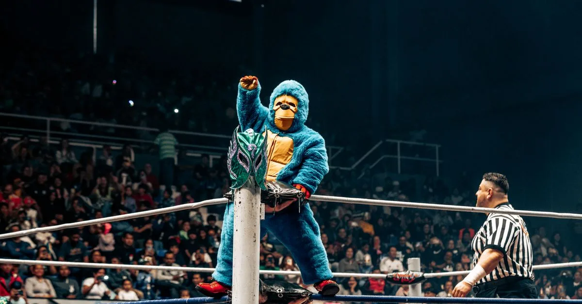 Colorful lucha libre match featuring mascots and referee in Mexico.