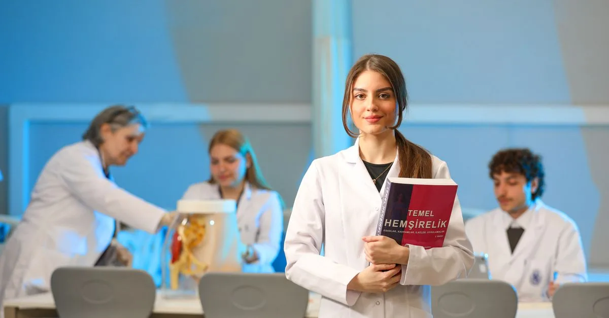 Young nursing students engaging in lab study, showcasing medical education.