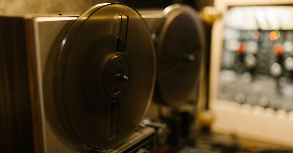 Close-up of a vintage tape recorder in a professional recording studio setting.