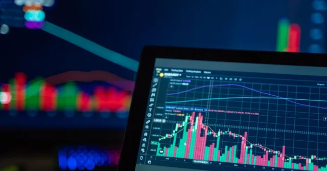Colorful trading charts showing cryptocurrency market trends on a computer screen.