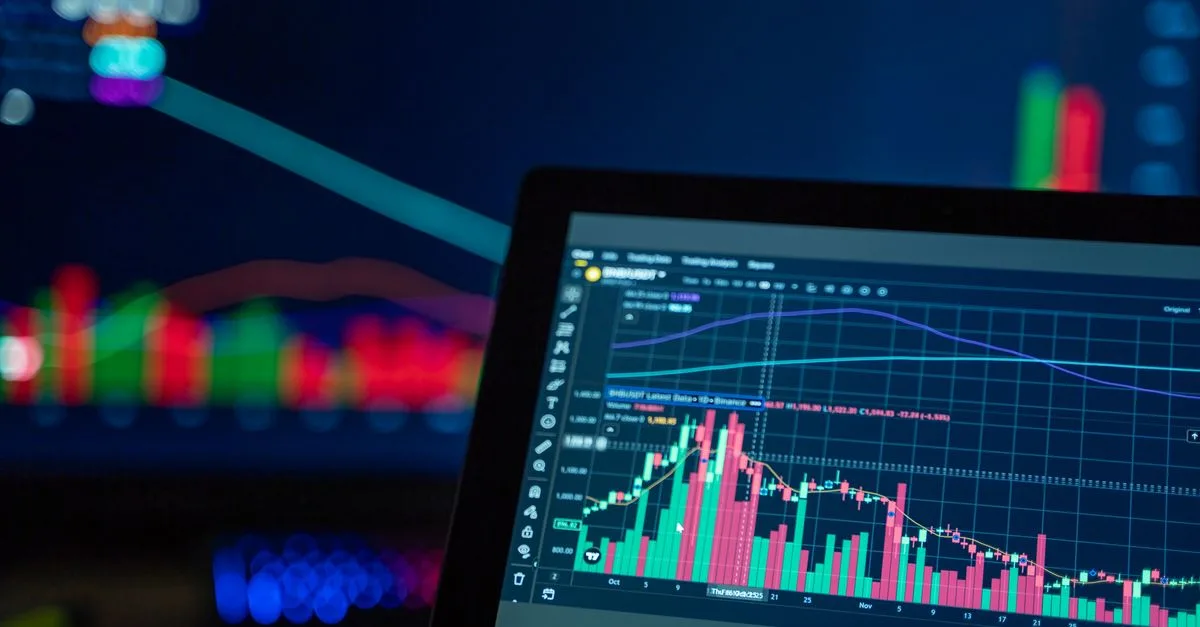 Colorful trading charts showing cryptocurrency market trends on a computer screen.