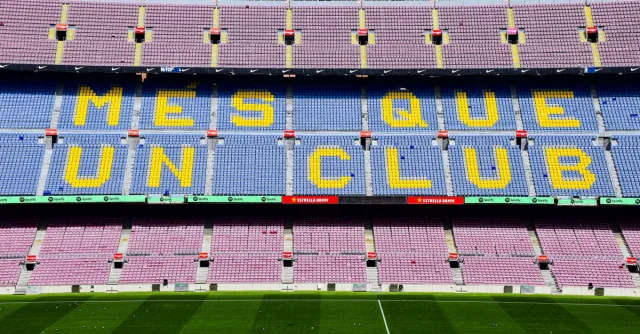 The iconic "Mes Que Un Club" slogan displayed at the Camp Nou stadium in Barcelona, Spain.
