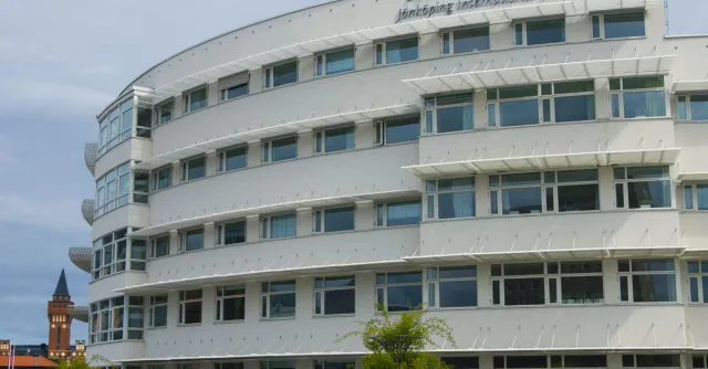 Curved facade of Jönköping University in Sweden showcasing modern architectural design.