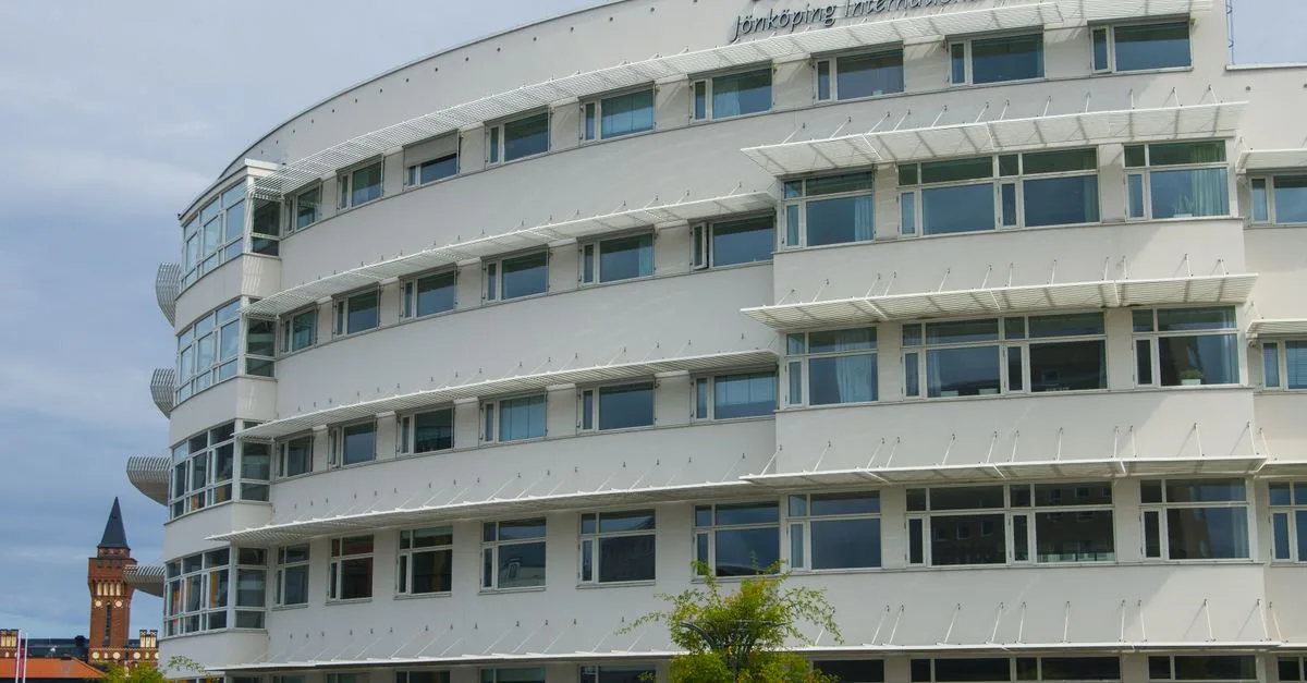 Curved facade of Jönköping University in Sweden showcasing modern architectural design.