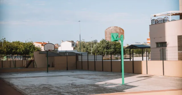 Empty basketball court in a residential outdoor area of Valencia, Spain.