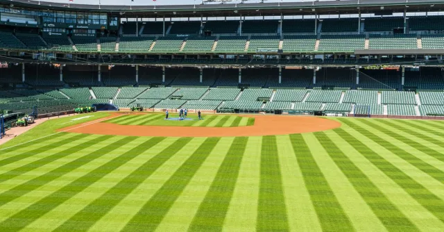 A vibrant view of Wrigley Field baseball stadium in Chicago on a sunny day.
