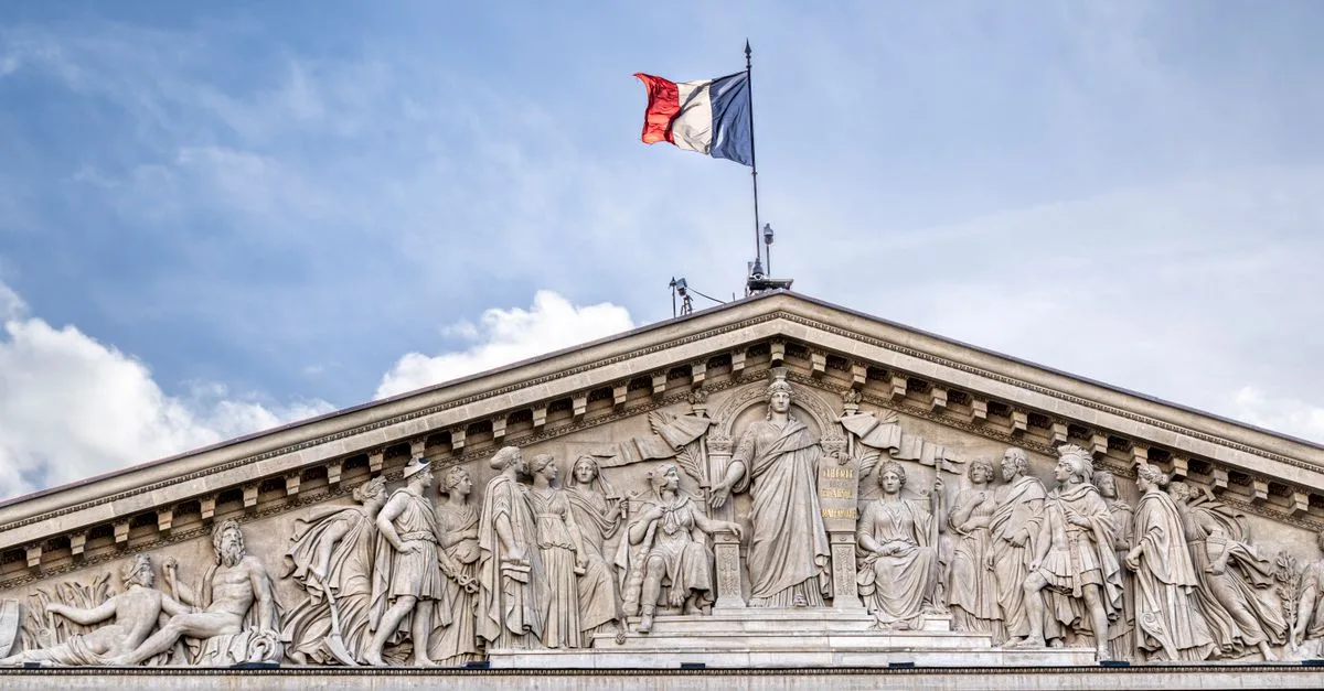 Facade of the French National Assembly building in Paris, showcasing its classical architecture.