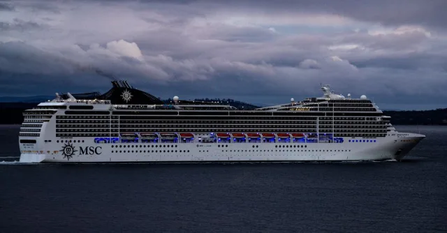 MSC cruise ship navigating waters near Hobart, Tasmania against a dramatic cloudy sky.