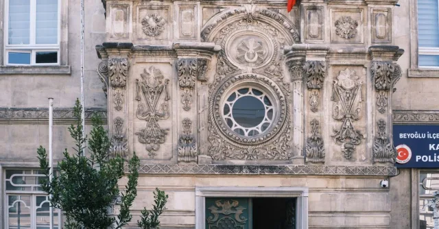 Historic facade of the Karaköy Police Station in Istanbul with intricate architectural details.