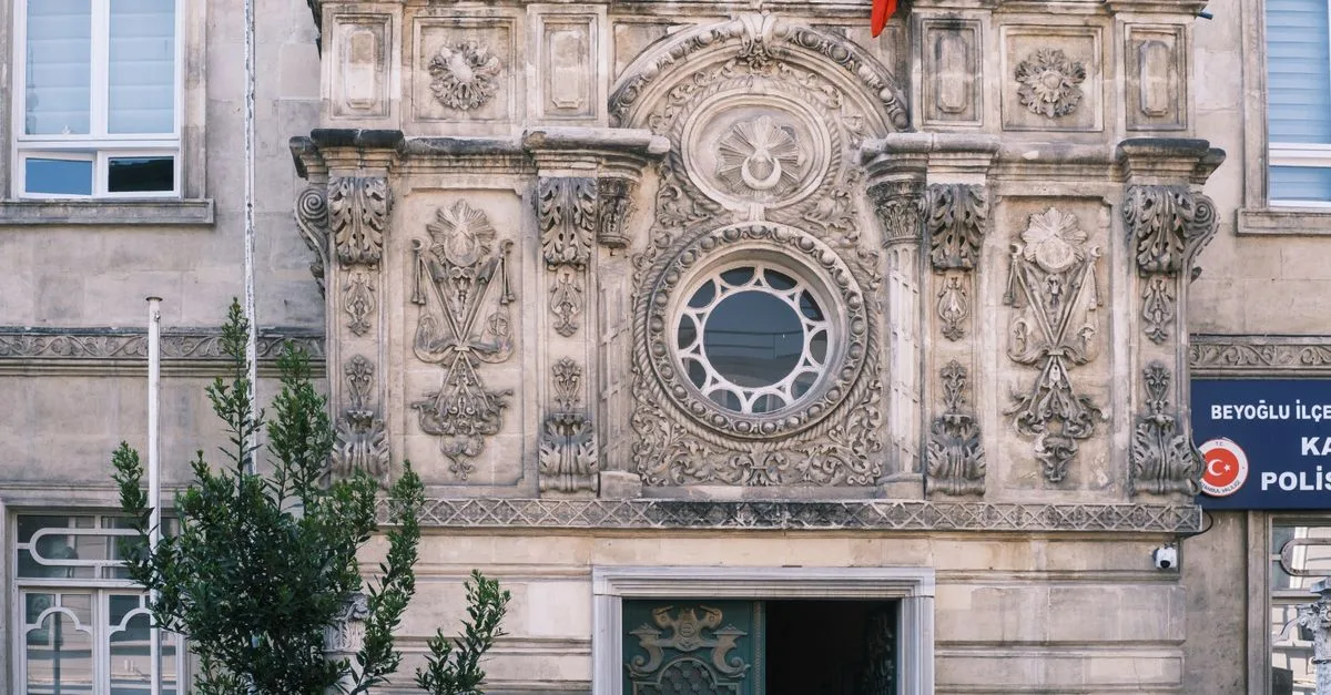 Historic facade of the Karaköy Police Station in Istanbul with intricate architectural details.