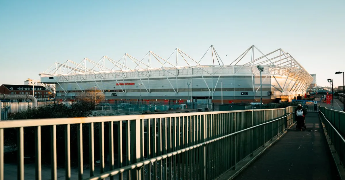 View of St Mary's Stadium in Southampton during sunset with a clear sky.