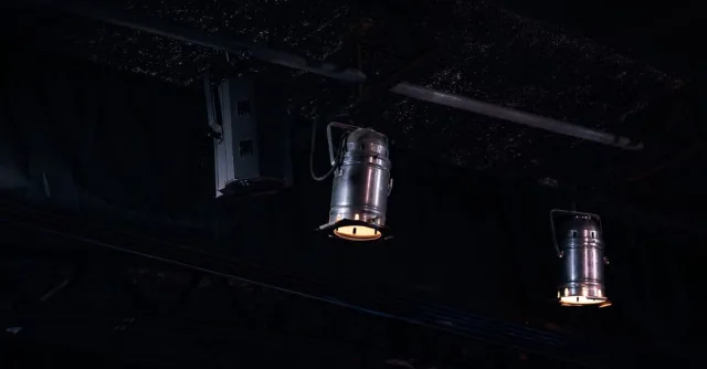 Close-up of hanging studio lights in a dark setting, Ciudad de México.