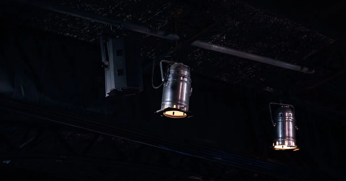 Close-up of hanging studio lights in a dark setting, Ciudad de México.