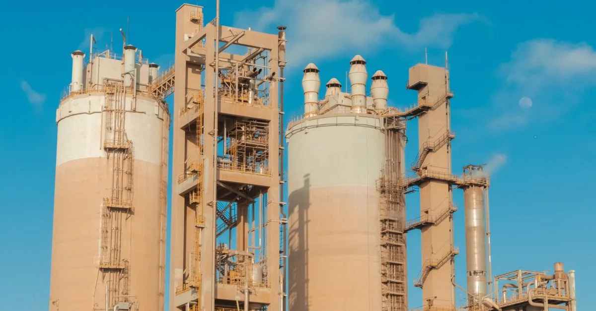 A view of urea towers at an industrial plant in Libya, captured on a clear day.