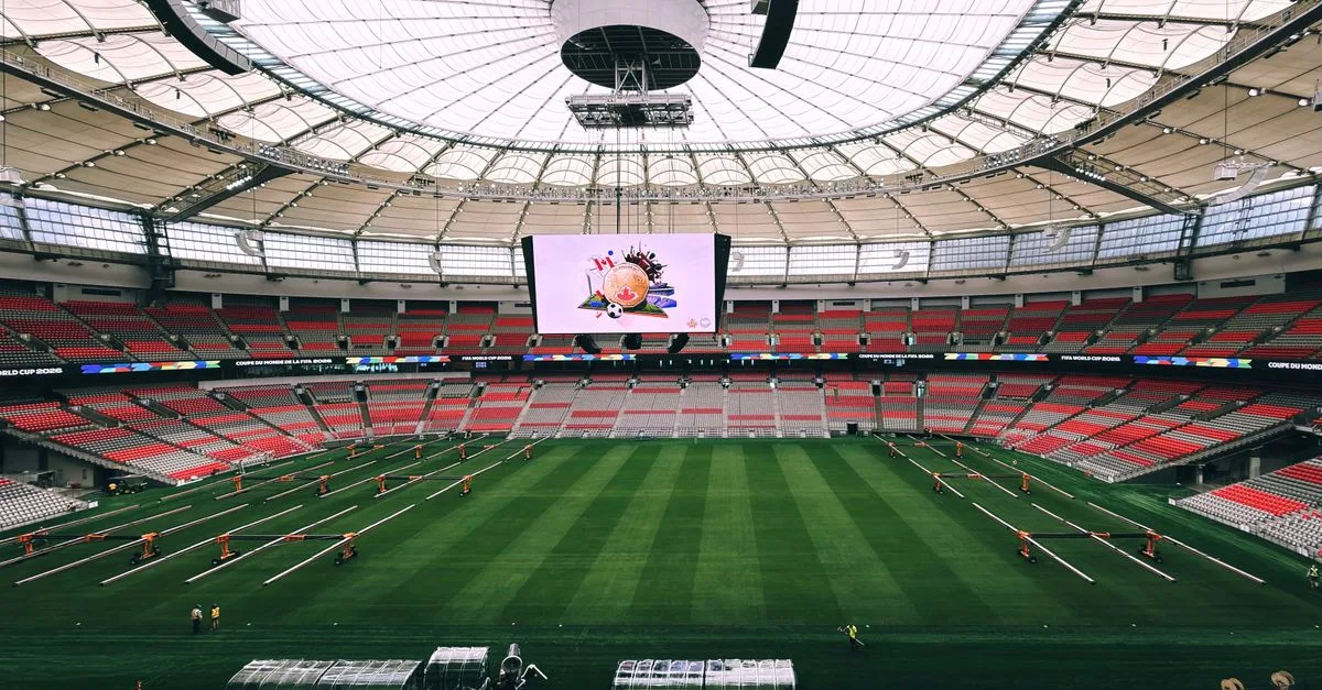 Interior view of BC Place Stadium in Vancouver, showcasing its vast seating and advanced roof structure.