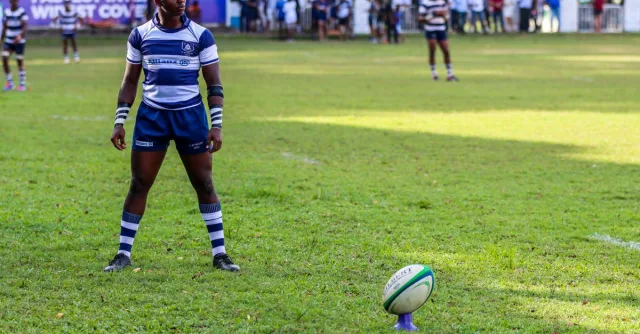 Focused rugby player preparing for a kick during a match in Colombo, Sri Lanka.