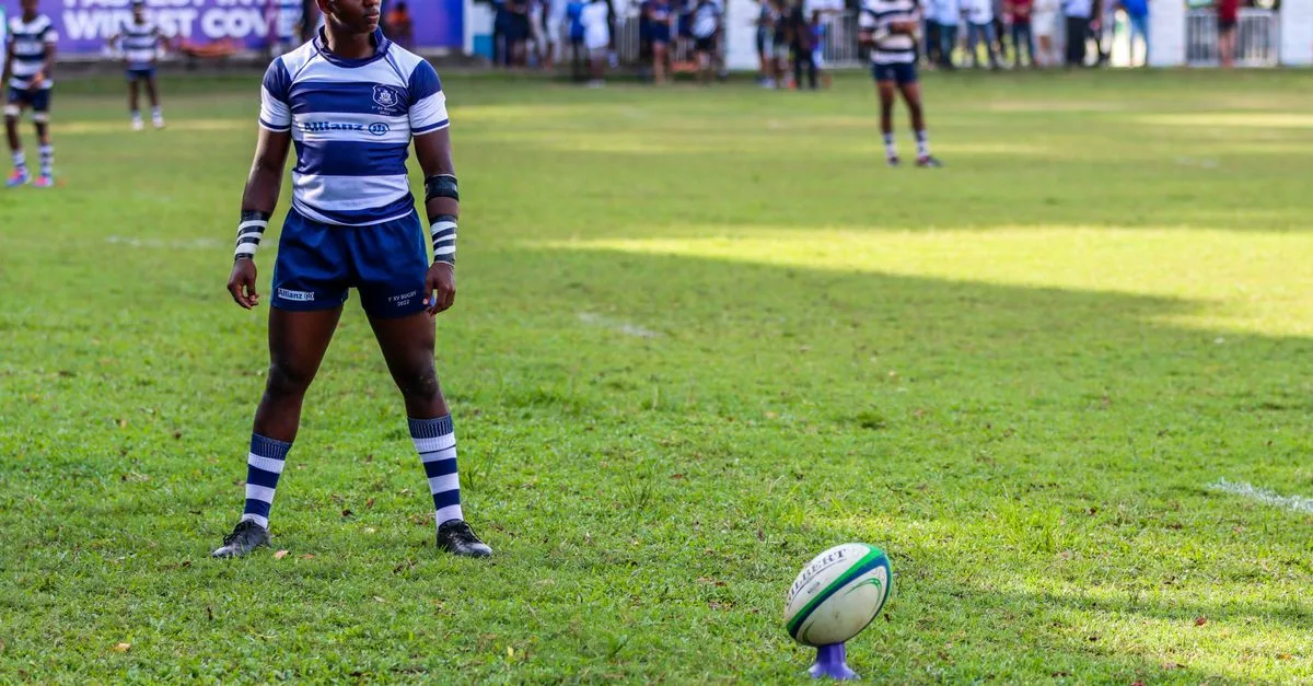 Focused rugby player preparing for a kick during a match in Colombo, Sri Lanka.