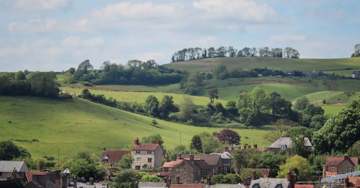 Scenic view of the countryside in Burton, England with rolling hills and picturesque houses.