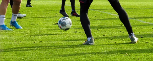 An empty football stadium pitch viewed from the stands.