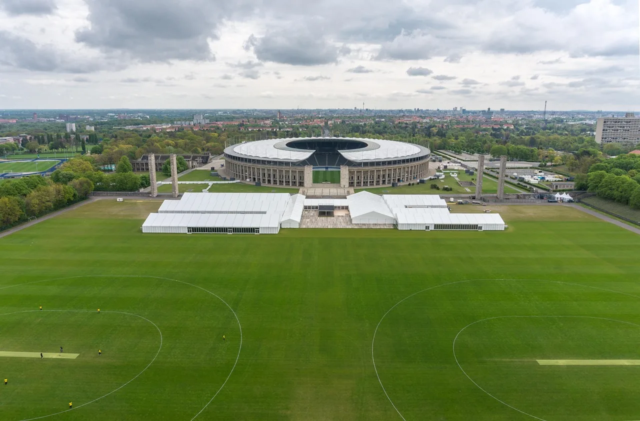 A professional football stadium pitch prepared for a match.