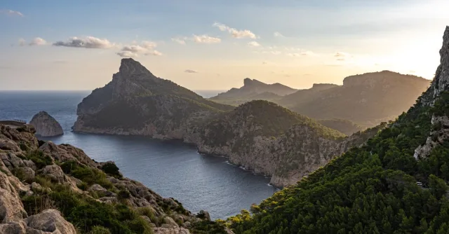 Majestic view of Cap de Formentor on the Mallorcan coast at sunset displaying stunning cliffs and the Mediterranean Sea.