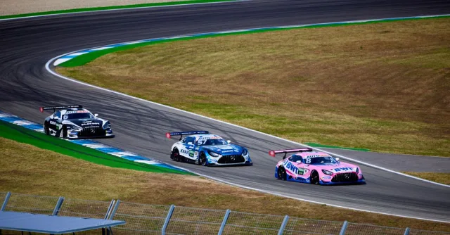 Exciting sports car race on Hockenheim Circuit, showcasing speed and skill on the track.