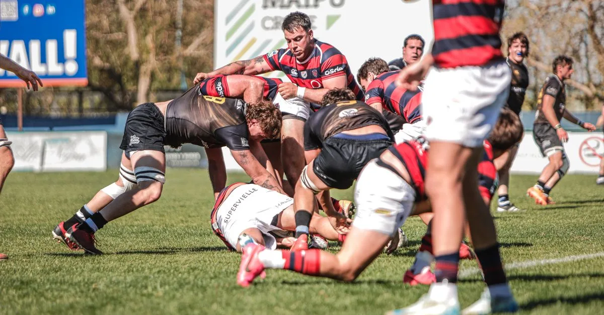 Rugby players competing in a dynamic match outdoors. Fierce action and teamwork on the field.