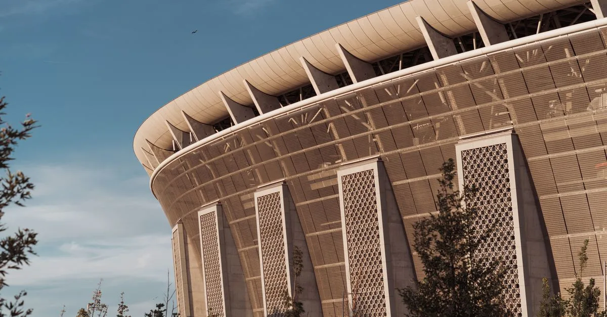 A close-up of Ferenc Puskás Stadium's architecture in Budapest, captured on a sunny day.