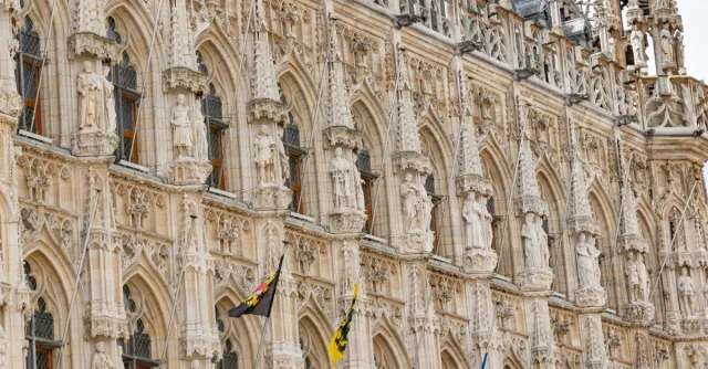Ornate facade of the historical Leuven Town Hall in Belgium.