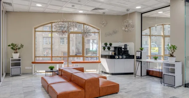 Elegant beauty parlor interior featuring a leather couch and contemporary design elements.