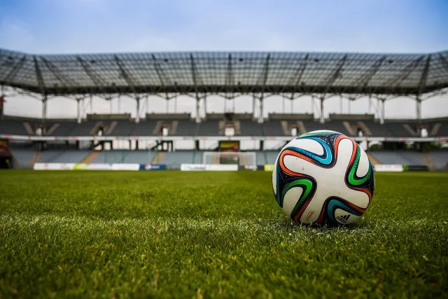 A wide view of a professional football stadium pitch prepared for a major international match.