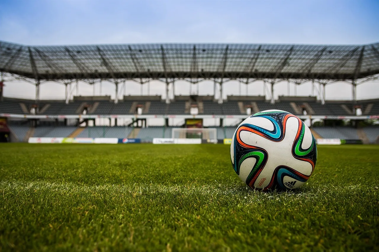 A wide view of a professional football stadium pitch prepared for a major international match.