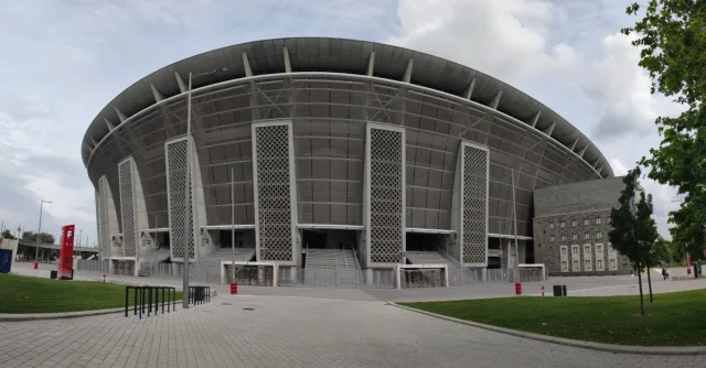Modern architecture of Puskás Aréna in Budapest, Hungary, showcasing its grand stadium design.